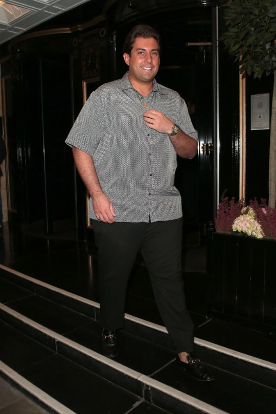 James Argent in 2018 wearing black trousers and a grey patterned shirt