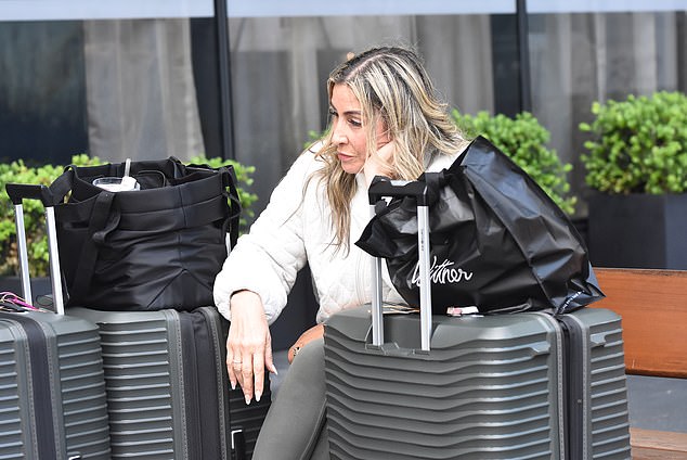 The 57-year-old mother-of-two was spotted waiting to be picked up, sitting on a bench just metres away from photographers, leaving on-lookers stunned