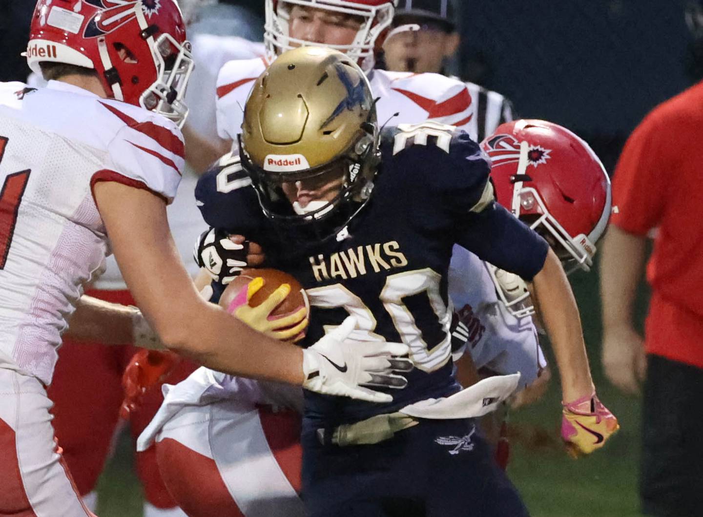 Hiawatha's Tim Pruitt tries to fight through a host of South Beloit tacklers during their game Friday, Sept. 20, 2024, at Hiawatha High School in Kirkland.