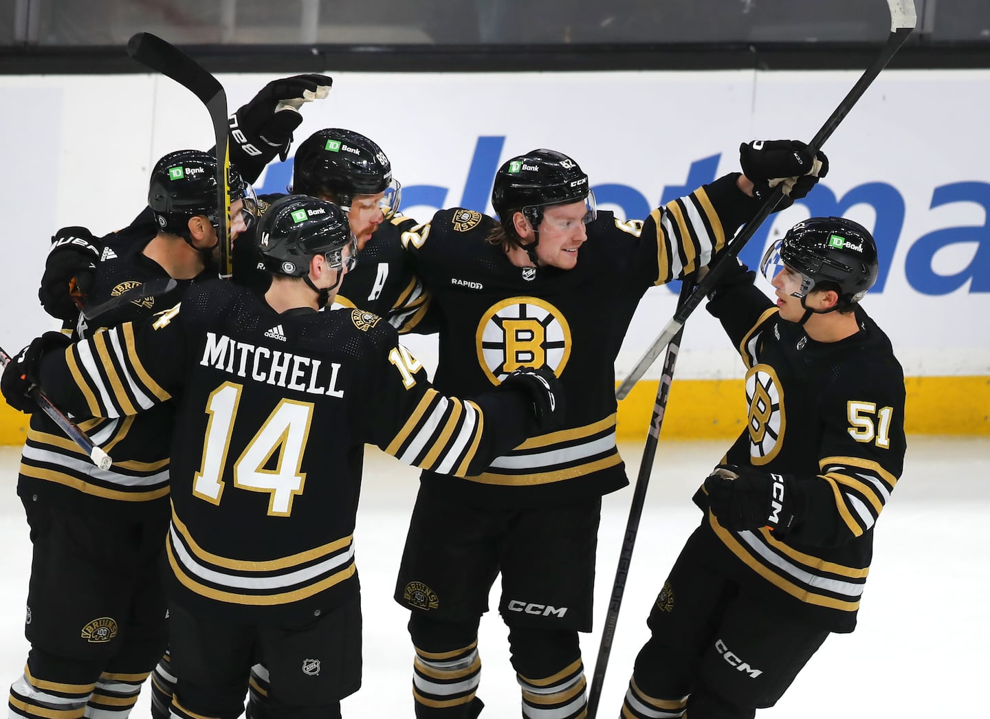 Matt Poitras (far right) posted five goals and 10 assists in 33 games for the Bruins last season.