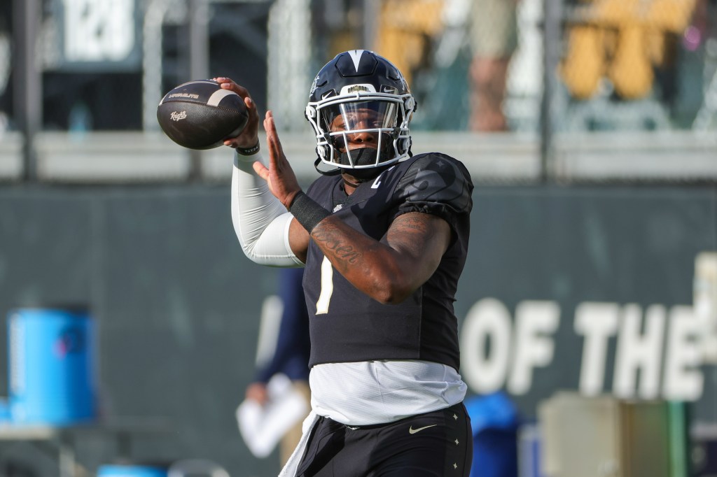 UCF Knights quarterback KJ Jefferson (1) warms up before the game against the New Hampshire Wildcats at FBC Mortgage Stadium.