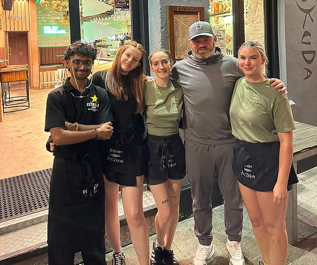 The football hero with bar staff this summer. He has even known to have come along for a pub quiz near his Plymouth pad