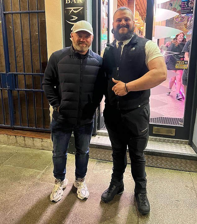 Wayne poses for a picture outside one of his local bars, where he was described as it their 'new regular'