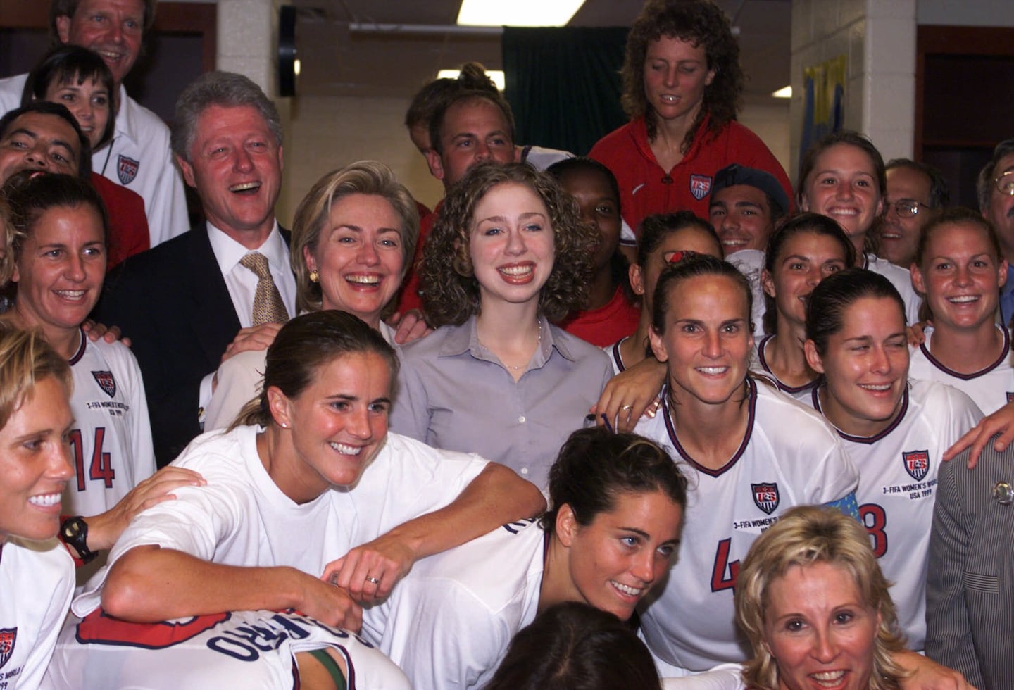President Clinton, Hillary Clinton, and daughter Chelsea were surrounded by the victorious USA Women's World Cup soccer team on July 1, 1999, at Jack Kent Stadium in Landover, Md. The US team defeated Germany, 3-2, in their quarterfinal match. 
