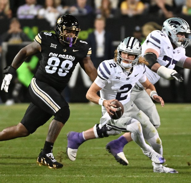 Colorado's Amari McNeill tries to chase down Kansas State quarterback...