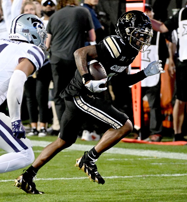 Colorado's LaJohntay Wester heads for end zone for a touchdown...
