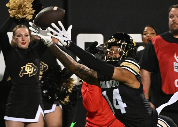 Colorado's Will Sheppard stretches for a ball that was just...