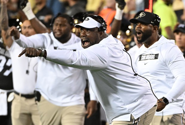Colorado graduate assistant coach Warren Sapp reacts to a play...