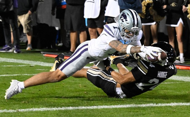 Kansas State's Jayce Brown reaches for the end zone over...