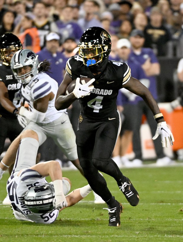 Colorado's Omarion Miller looks for extra yards after a catch...