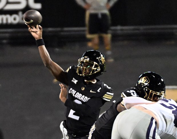 Colorado quarterback Shedeur Sanders throw a pass against against Kansas...