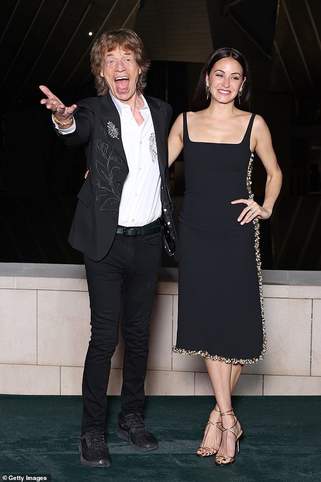 However, despite sources saying that they were 'both single' at the time, their budding romance caused quite the stir after Mick's spokesperson insisted that he was still in a relationship with Melanie Hamrick (Mick and Melanie pictured in July)