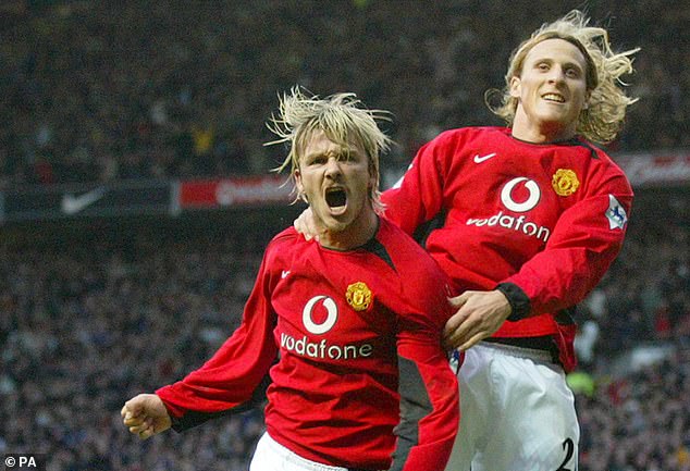 Forlan (right, pictured with David Beckham) helped Man United win the Premier League in '03