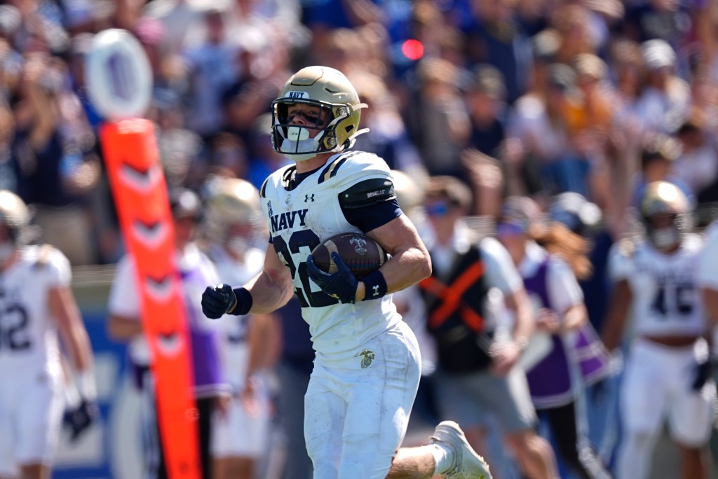Navy running back Eli Heidenreich runs for a long gain in the second half of an NCAA college football game against Air Force Saturday, Oct. 5, 2024, at Air Force Academy, Colo.