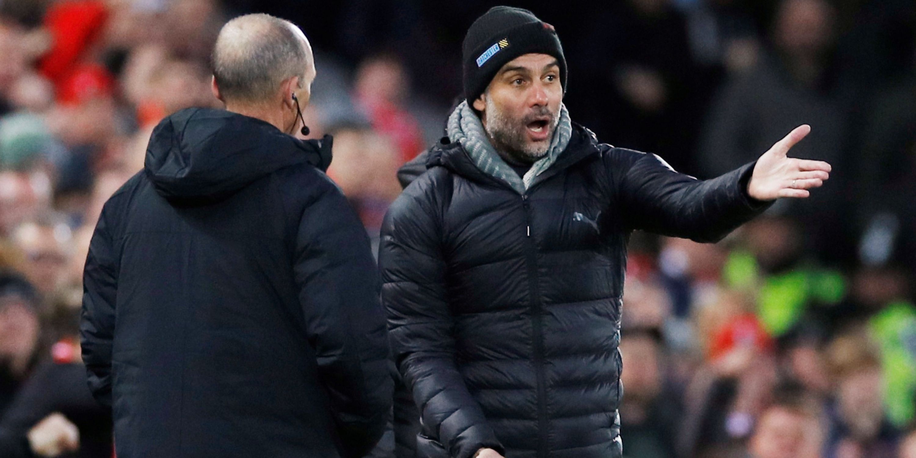 Manchester City manager Pep Guardiola remonstrates with fourth offical Mike Dean on the touchline.