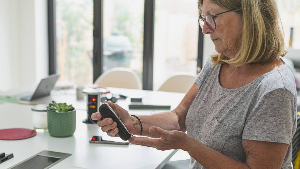 Woman checking blood sugar levels