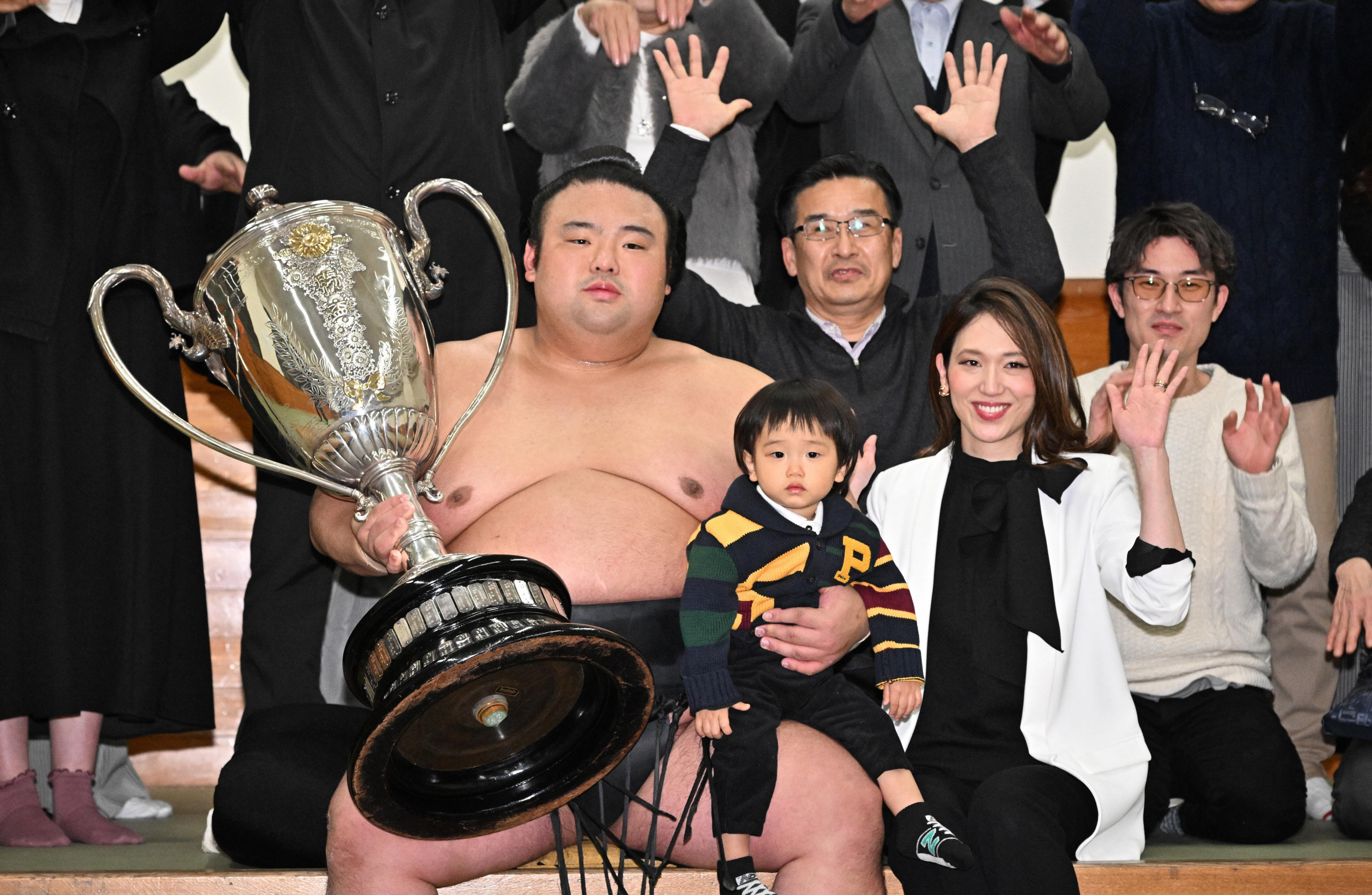 Takakeisho with his family and supporters in the dressing room after achieving the title of ozeki or champion at the Grand Sumo New Year Tournament in 2023