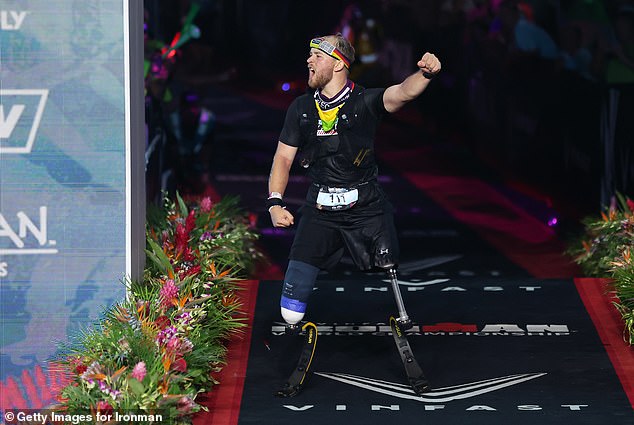 Billy Monger is pictured in the seconds after he smashed the Ironman record for a double amputee at the World Championship in Hawaii