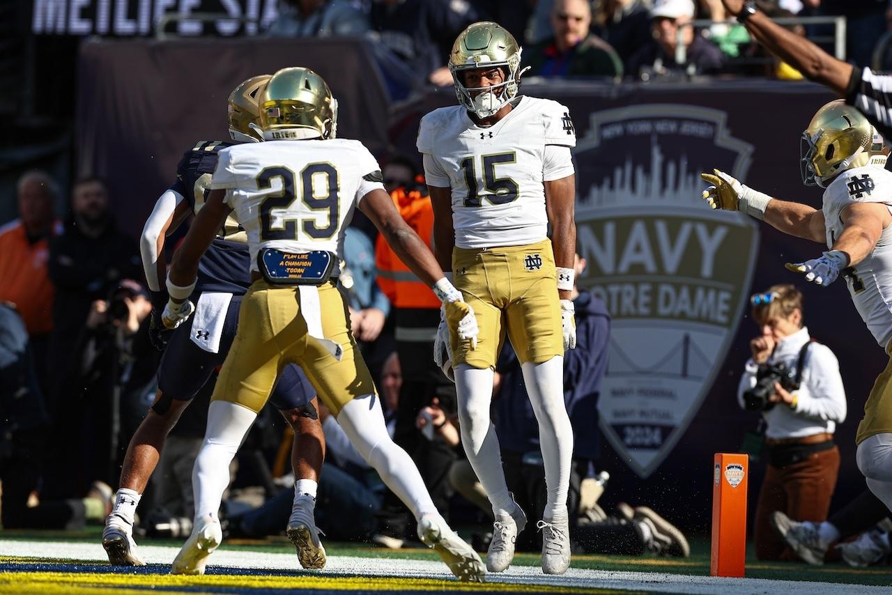 Notre Dame players celebrate against Navy.
