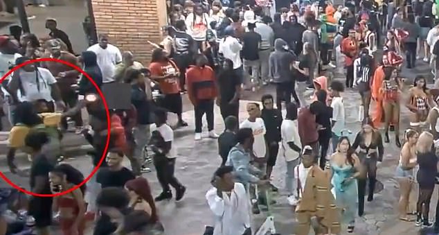 Police have released footage of the moment he allegedly opened fire on the crowd