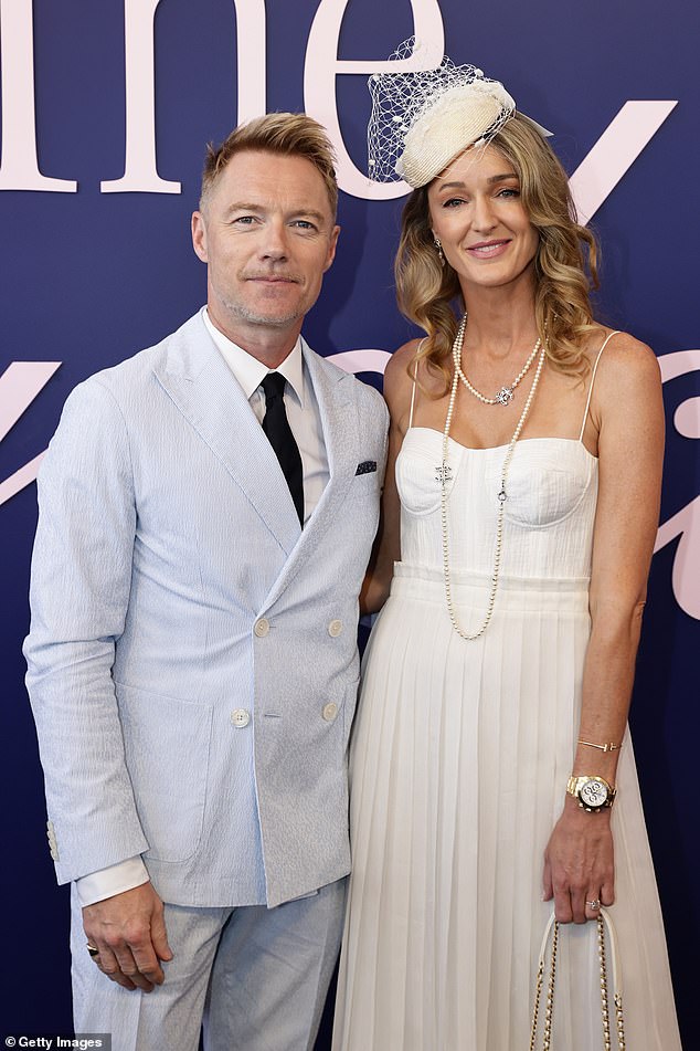 Ronan's appearance at the Melbourne Cup comes after he confirmed that he has moved to Australia with his family (pictured with his wife Storm)