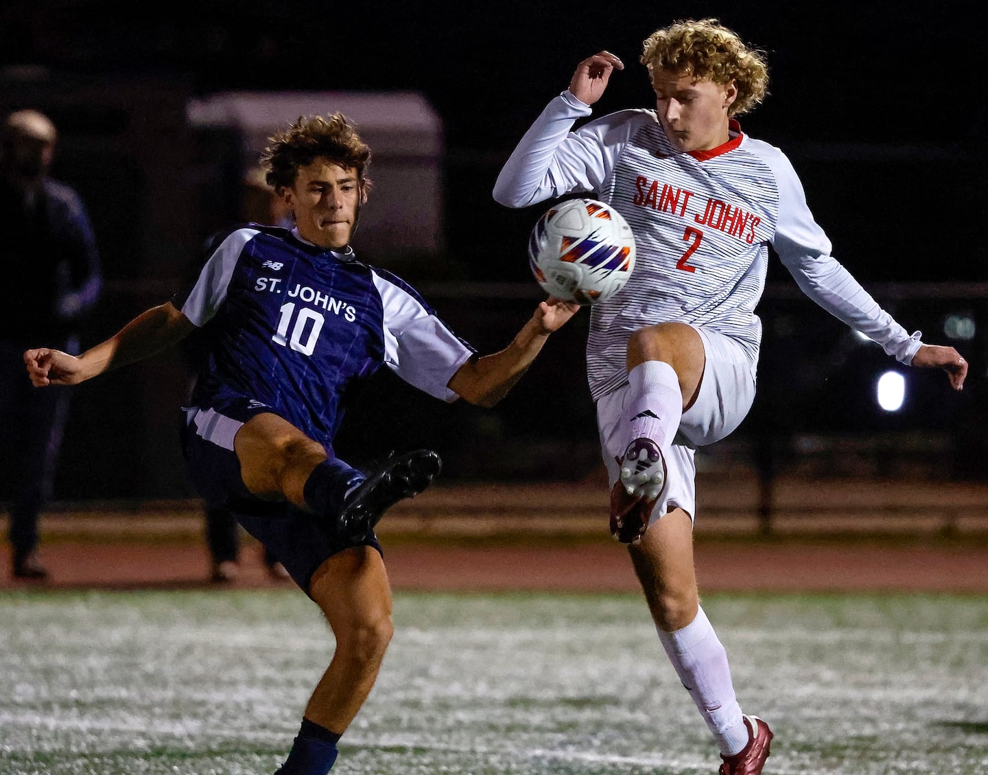 St. John's Prep's Jackson Quigley and Drew Louto of St. John's (Shrewsbury) fight for possession in the second half.