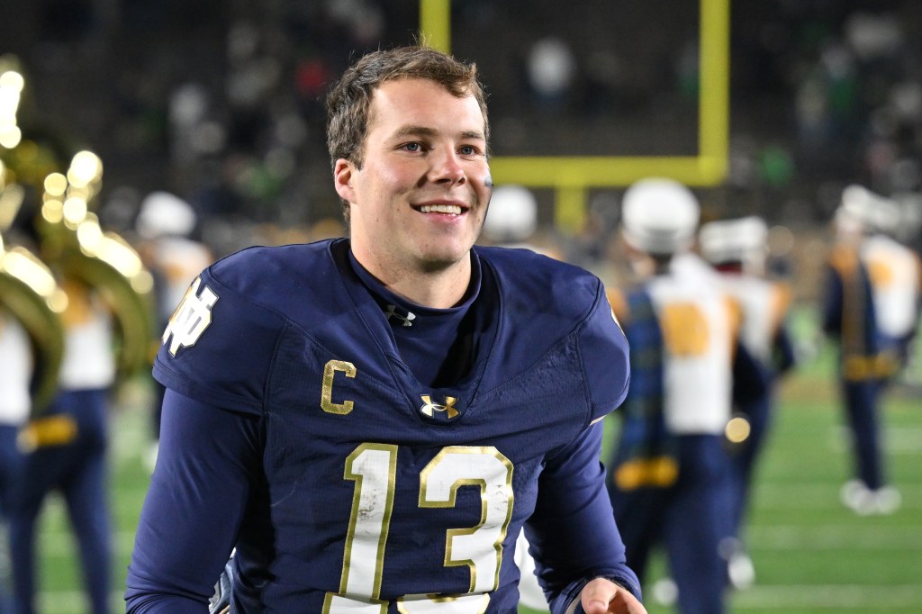 Notre Dame Fighting Irish quarterback Riley Leonard (13) leaves the field following a 52-3 victory over the Florida State Seminoles at Notre Dame Stadium. 