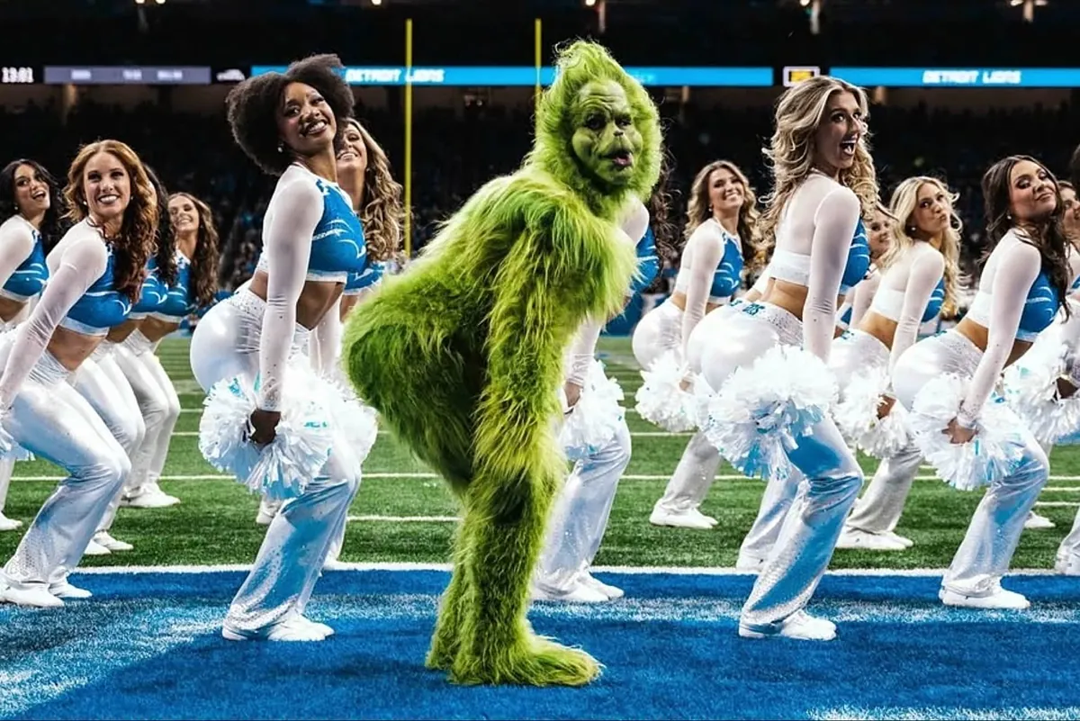 The Grinch danced and met with Lions legend Barry Sanders in a night of football and fun in Detroit
